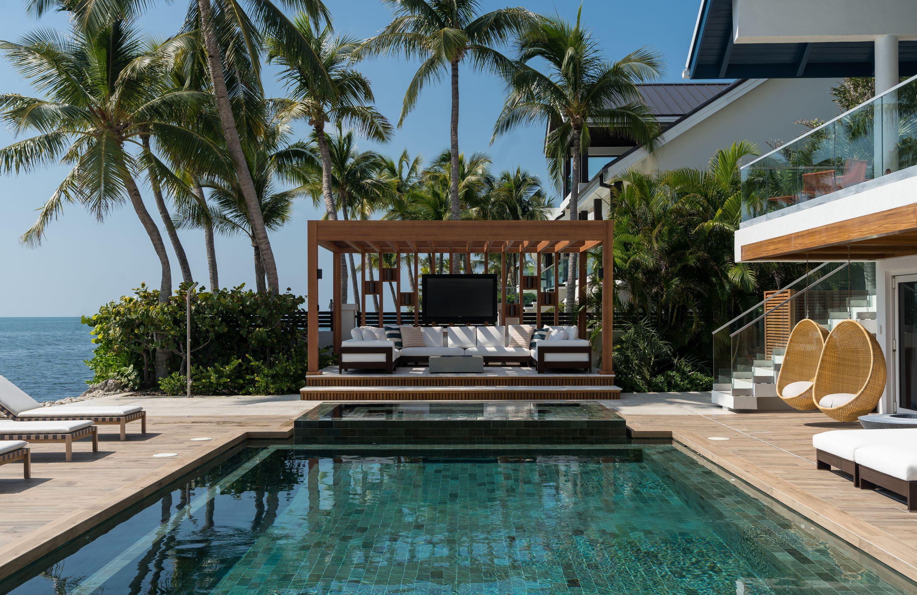 555 Ocean Cay Key Largo, FL 33037 - Photo 39 of 46 a view of a house with swimming pool and sitting area