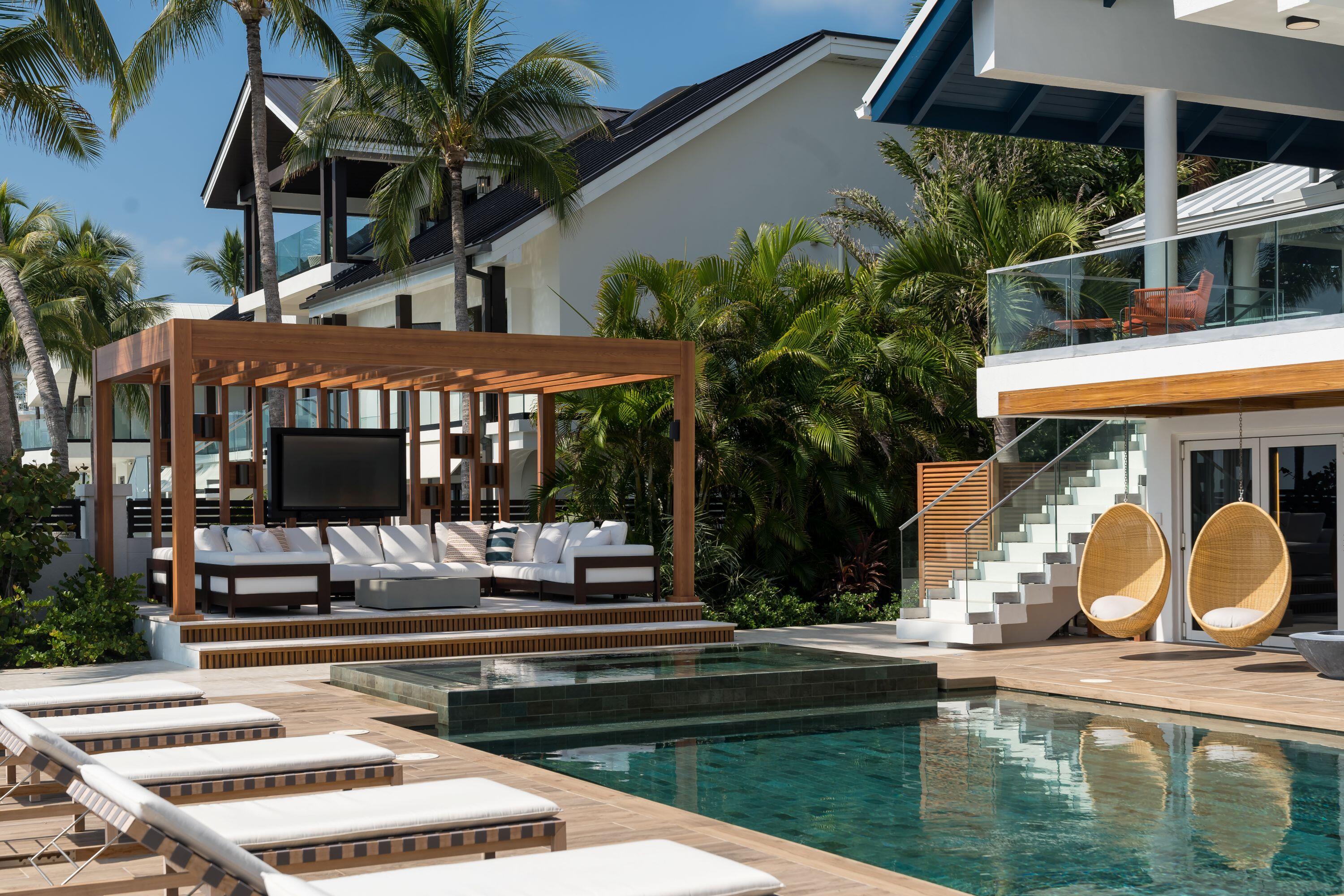 555 Ocean Cay Key Largo, FL 33037 - Photo 41 of 46 a front view of a house with swimming pool and porch