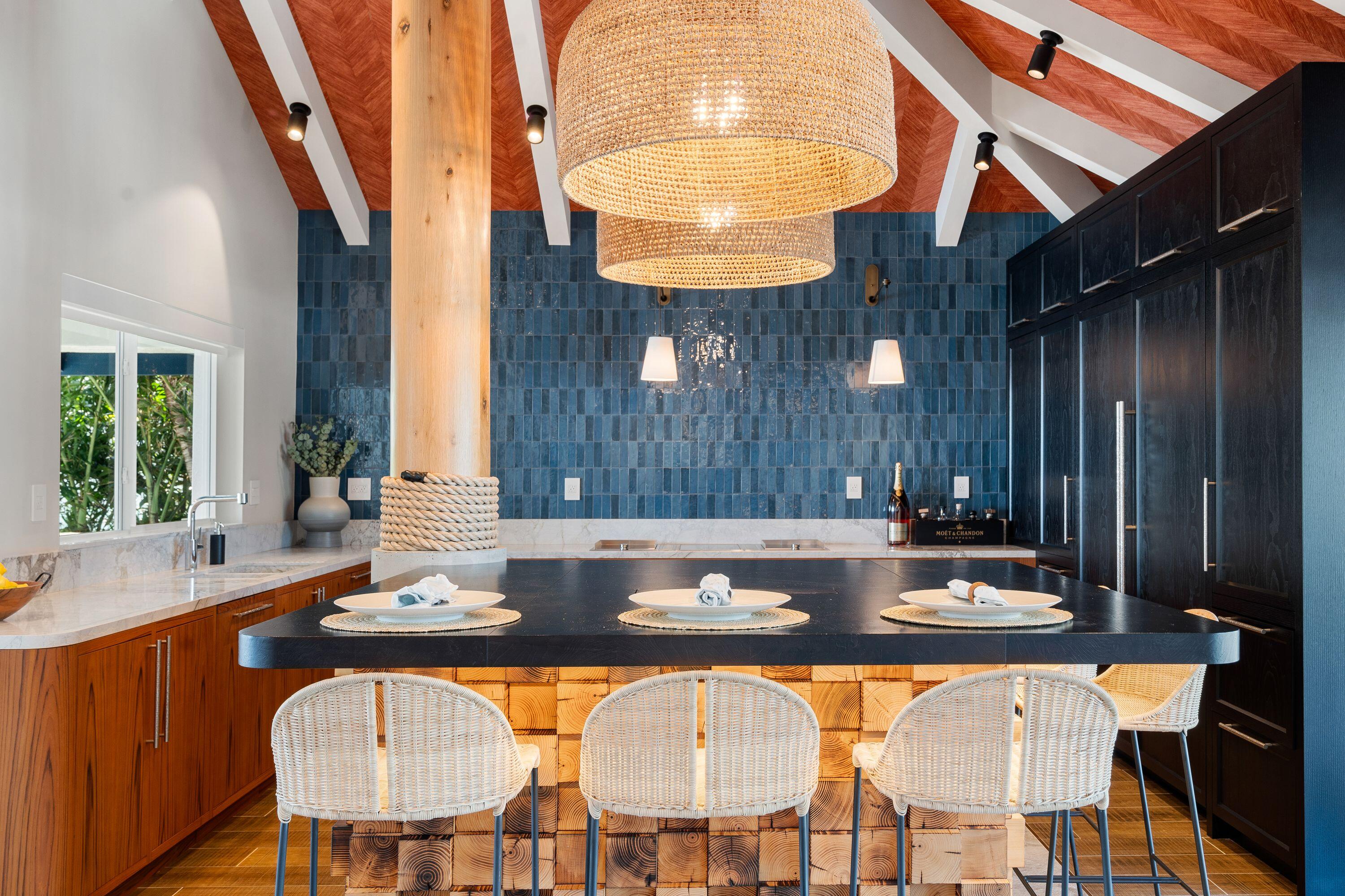 555 Ocean Cay Key Largo, FL 33037 - Photo 8 of 46 a kitchen with a table chairs and a chandelier