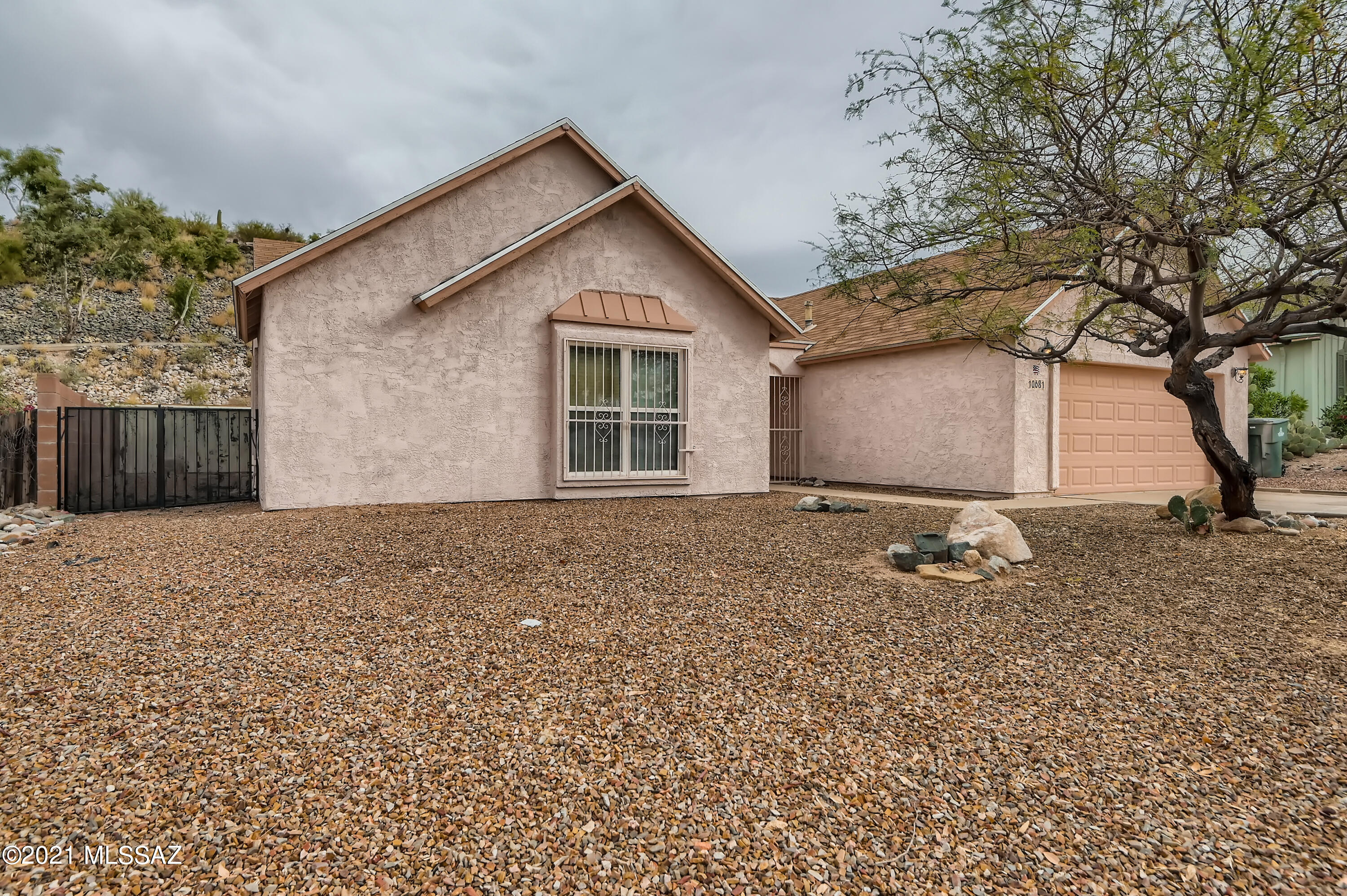 10681 Keystone Road East Tucson, AZ 85730 - Photo 2 of 33 a house with trees in the background