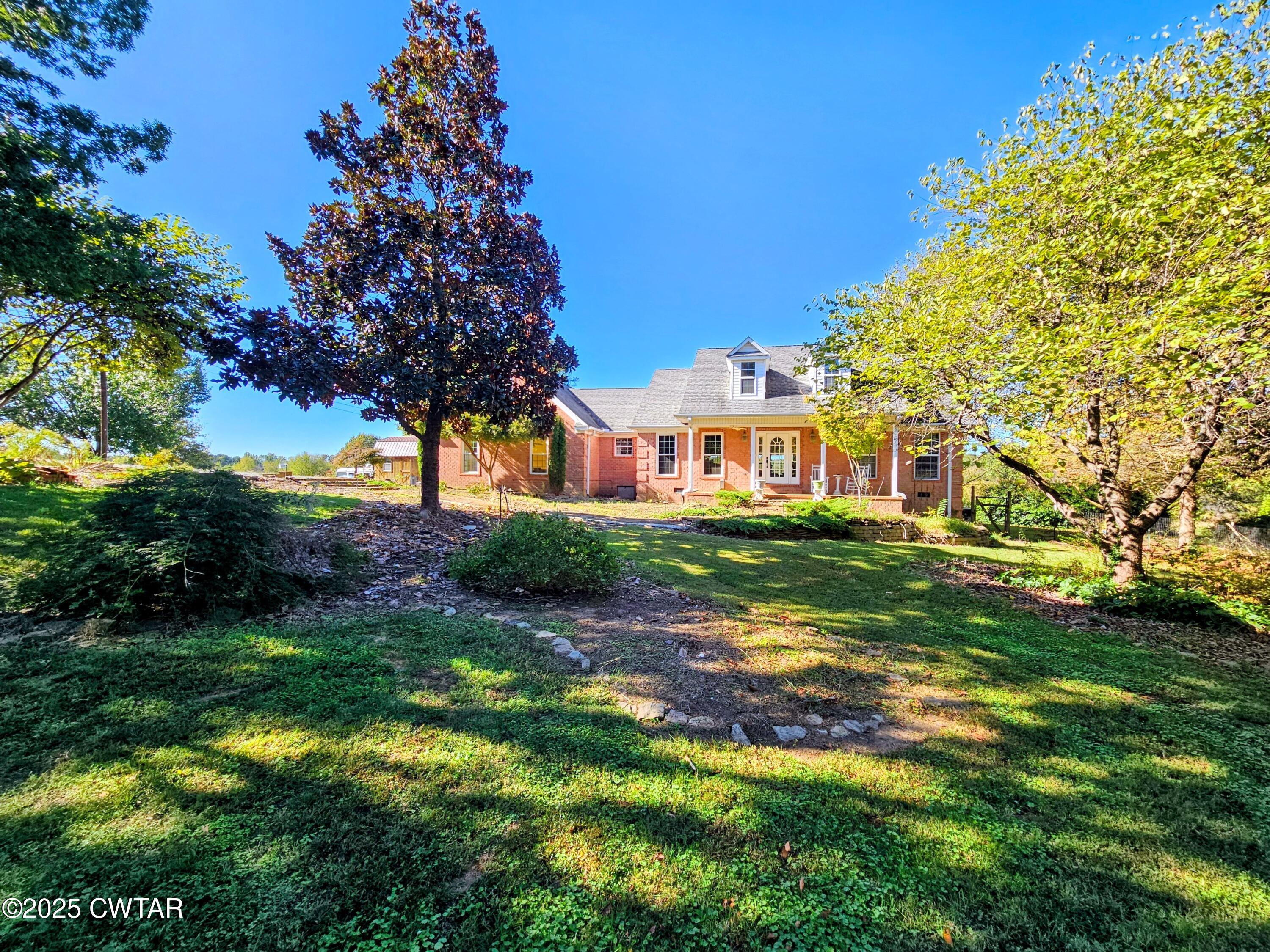 a view of a house with a big yard