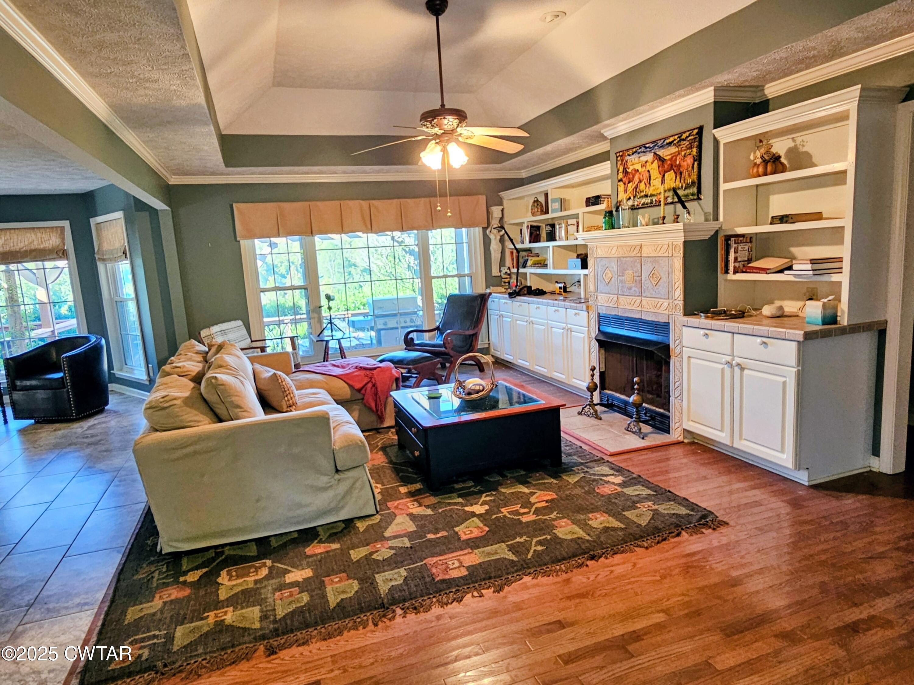 125 Hurts Chapel Road Jackson, TN 38301 - Photo 11 of 50 a living room with furniture windows and a fireplace