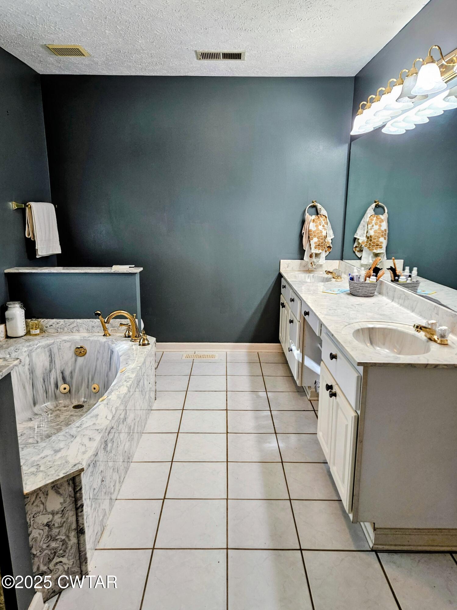 125 Hurts Chapel Road Jackson, TN 38301 - Photo 18 of 50 a bedroom with a bed and a mirror