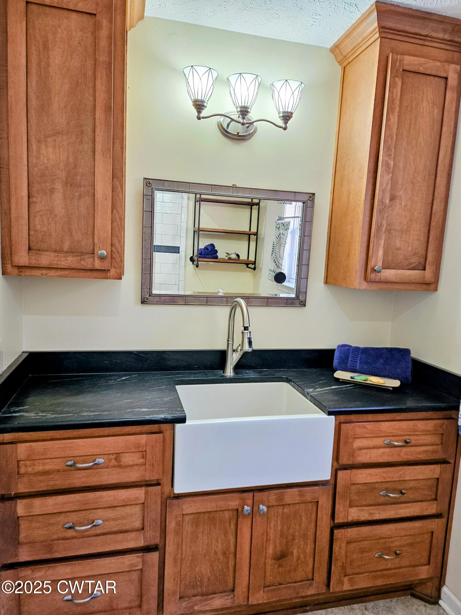 125 Hurts Chapel Road Jackson, TN 38301 - Photo 21 of 50 a kitchen with a sink and cabinets