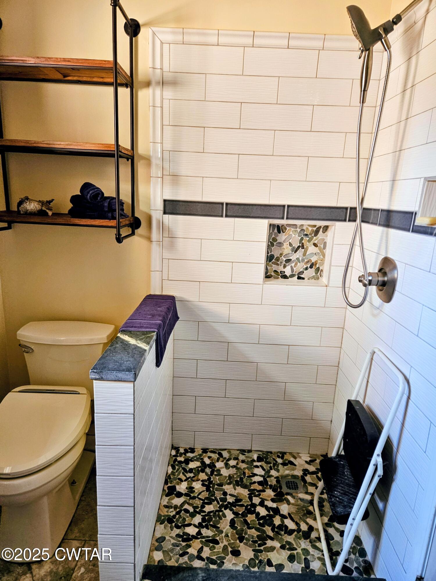 125 Hurts Chapel Road Jackson, TN 38301 - Photo 22 of 50 a bathroom with a toilet and a shower