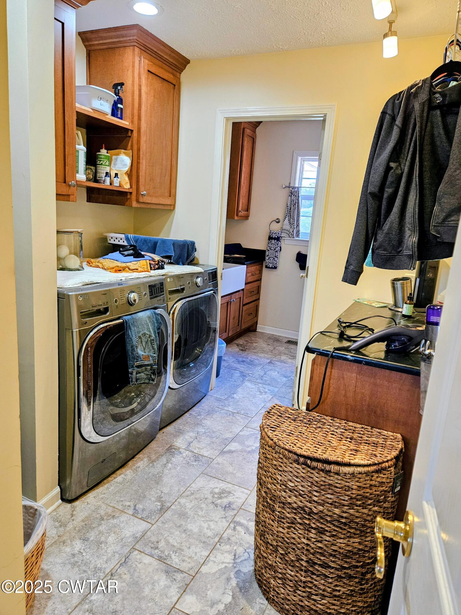 125 Hurts Chapel Road Jackson, TN 38301 - Photo 23 of 50 a living room with furniture and a washer dryer