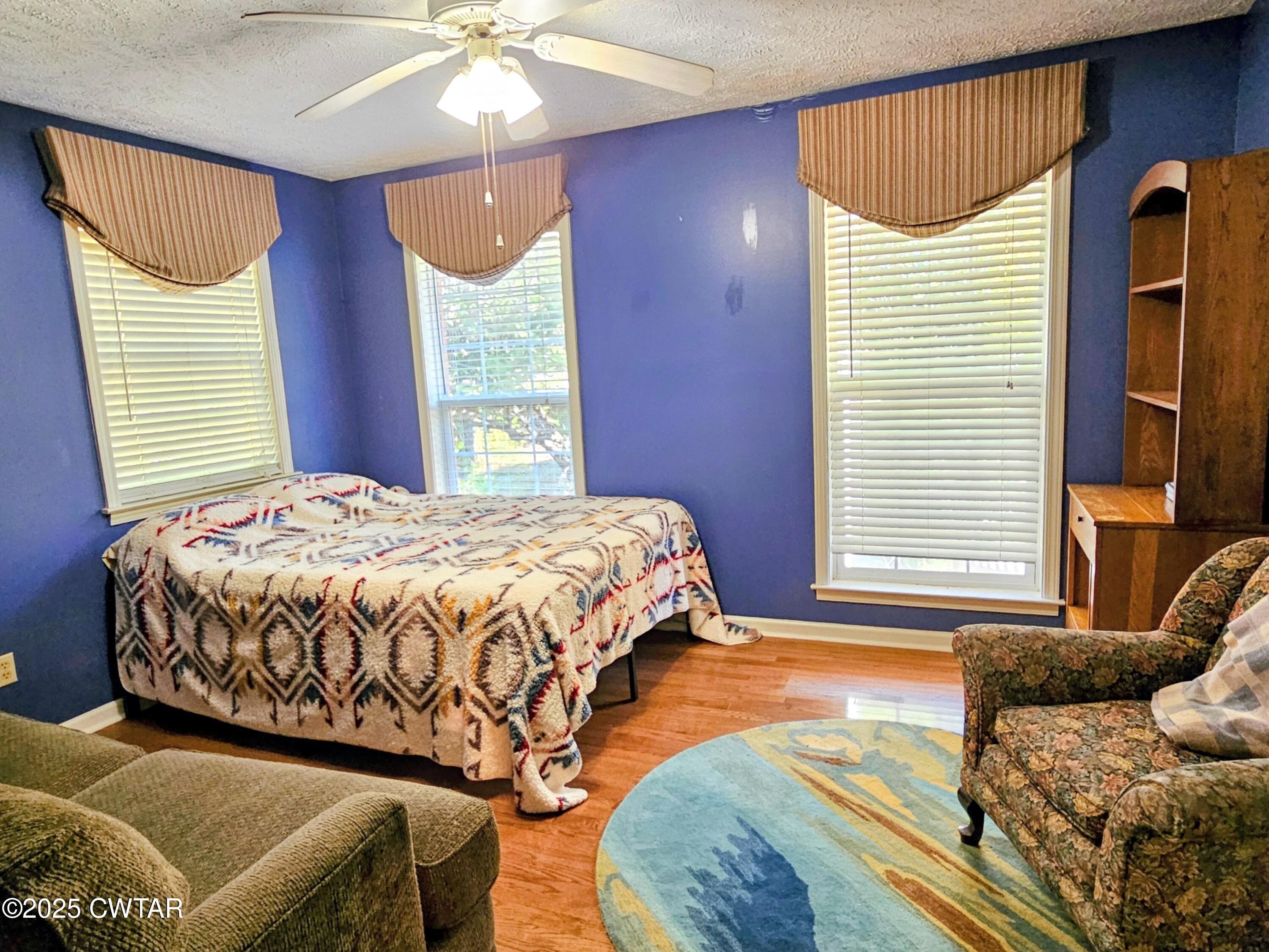 125 Hurts Chapel Road Jackson, TN 38301 - Photo 25 of 50 a bedroom with a bed mirror and window