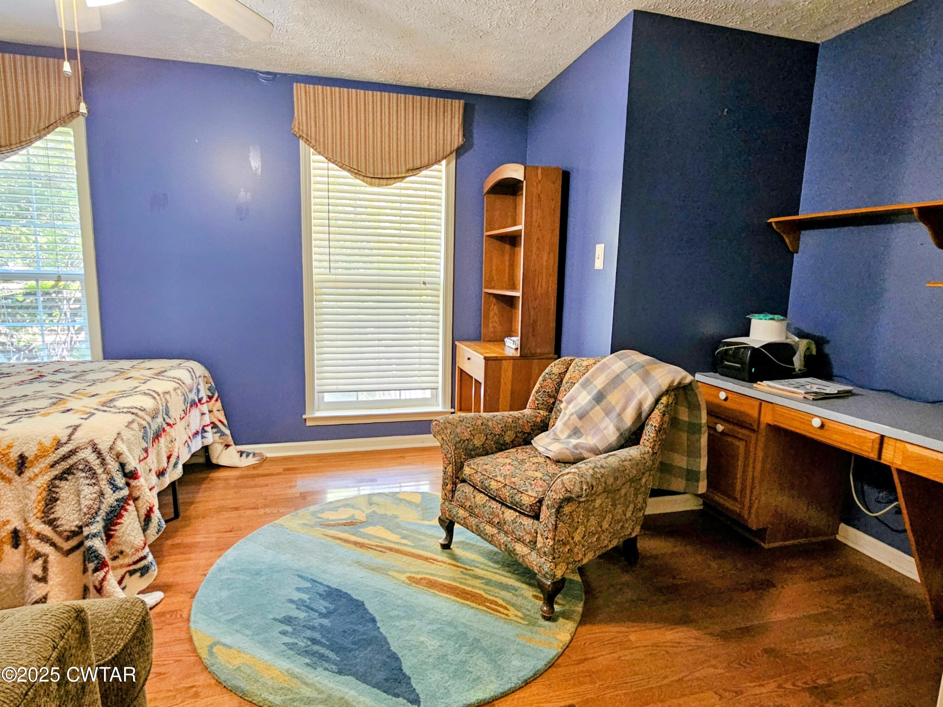 125 Hurts Chapel Road Jackson, TN 38301 - Photo 26 of 50 a bedroom with furniture and a wooden floor