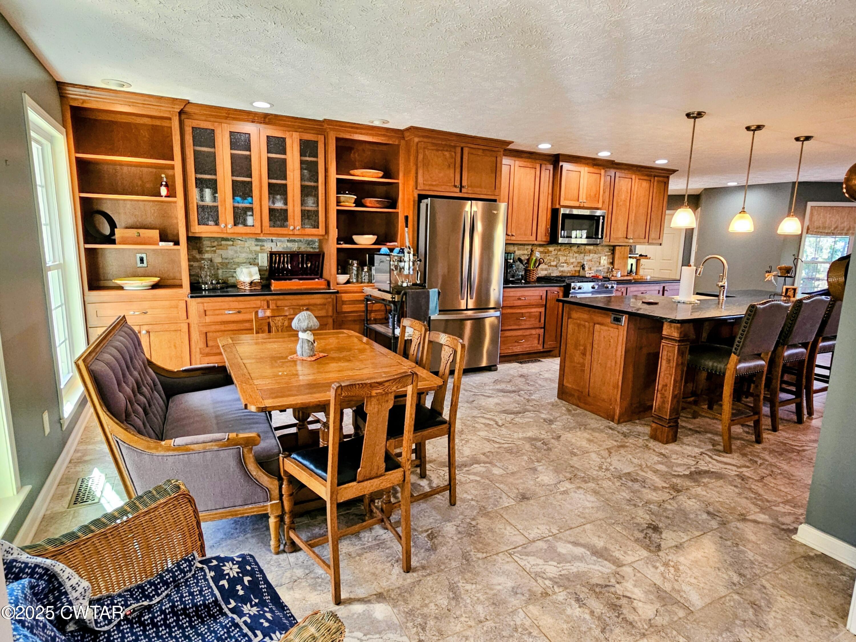 125 Hurts Chapel Road Jackson, TN 38301 - Photo 4 of 50 a dining table and chairs with a view of kitchen