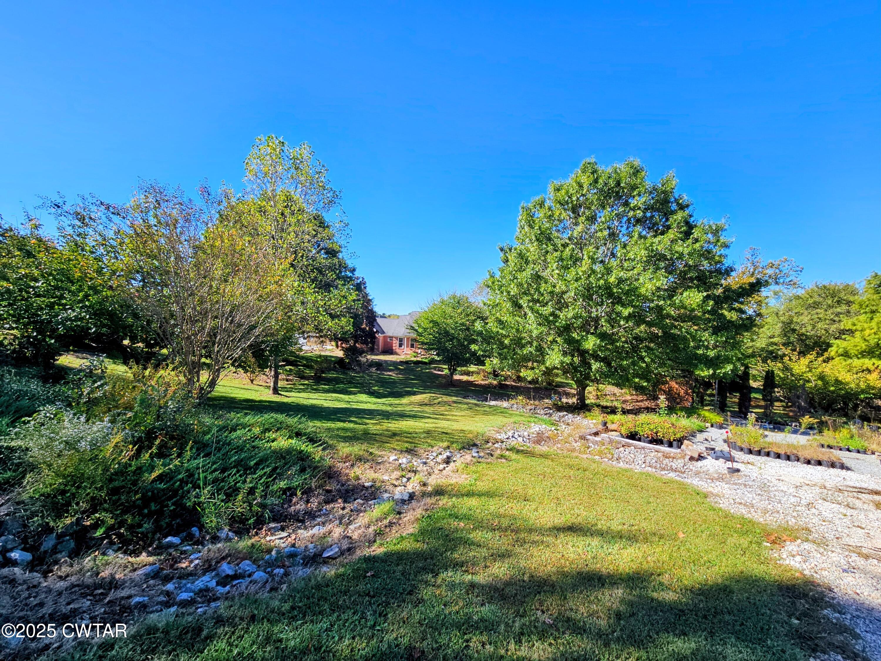 125 Hurts Chapel Road Jackson, TN 38301 - Photo 42 of 50 a view of a house with a yard