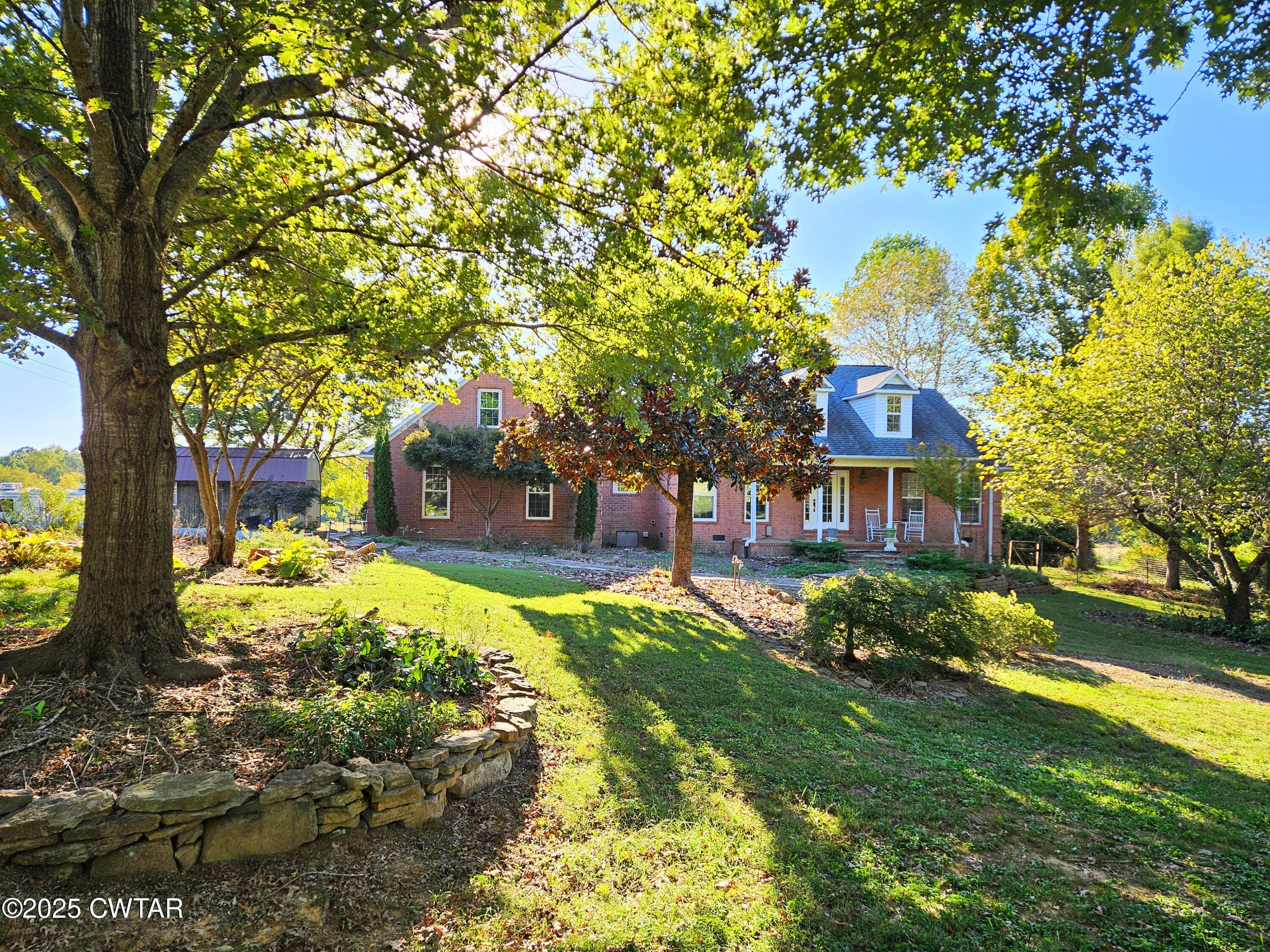 125 Hurts Chapel Road Jackson, TN 38301 - Photo 45 of 50 a front view of a house with a yard