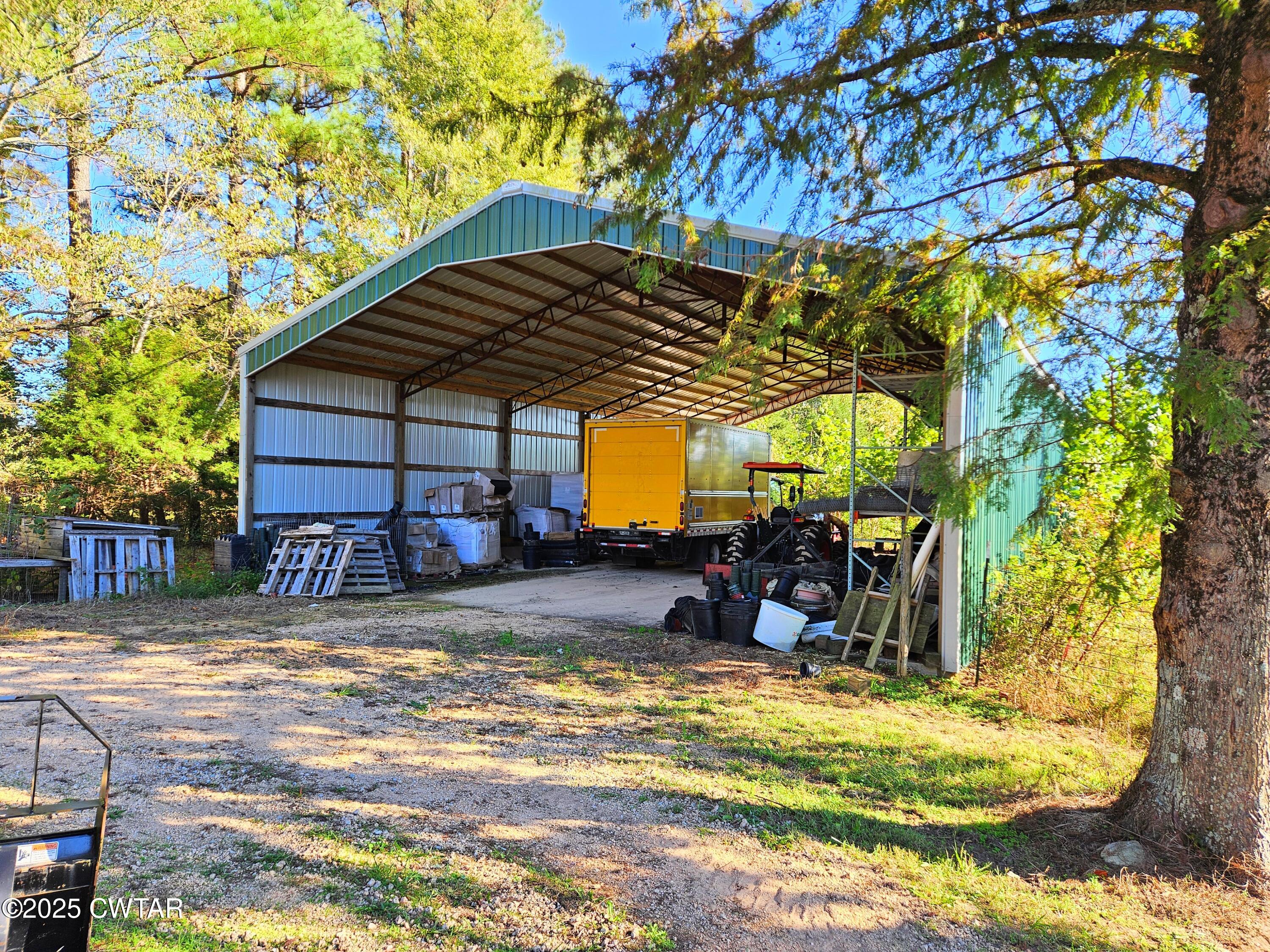 125 Hurts Chapel Road Jackson, TN 38301 - Photo 48 of 50 a view of a house with a patio