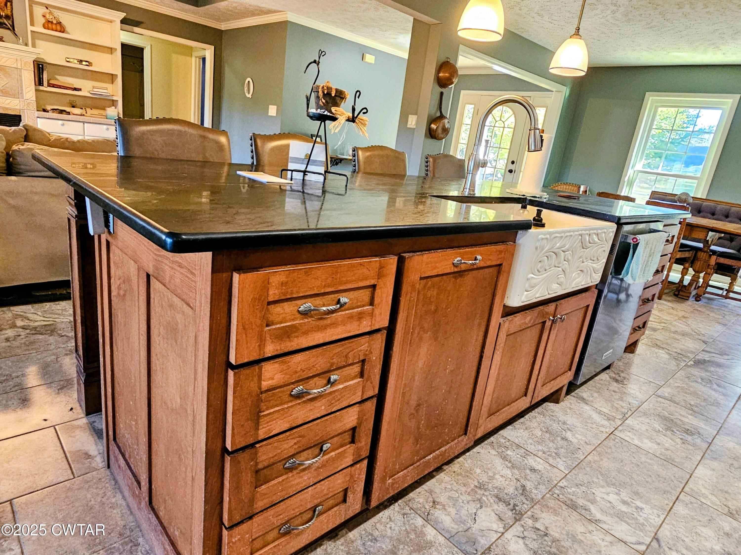 125 Hurts Chapel Road Jackson, TN 38301 - Photo 7 of 50 a room with granite countertop a sink and cabinets