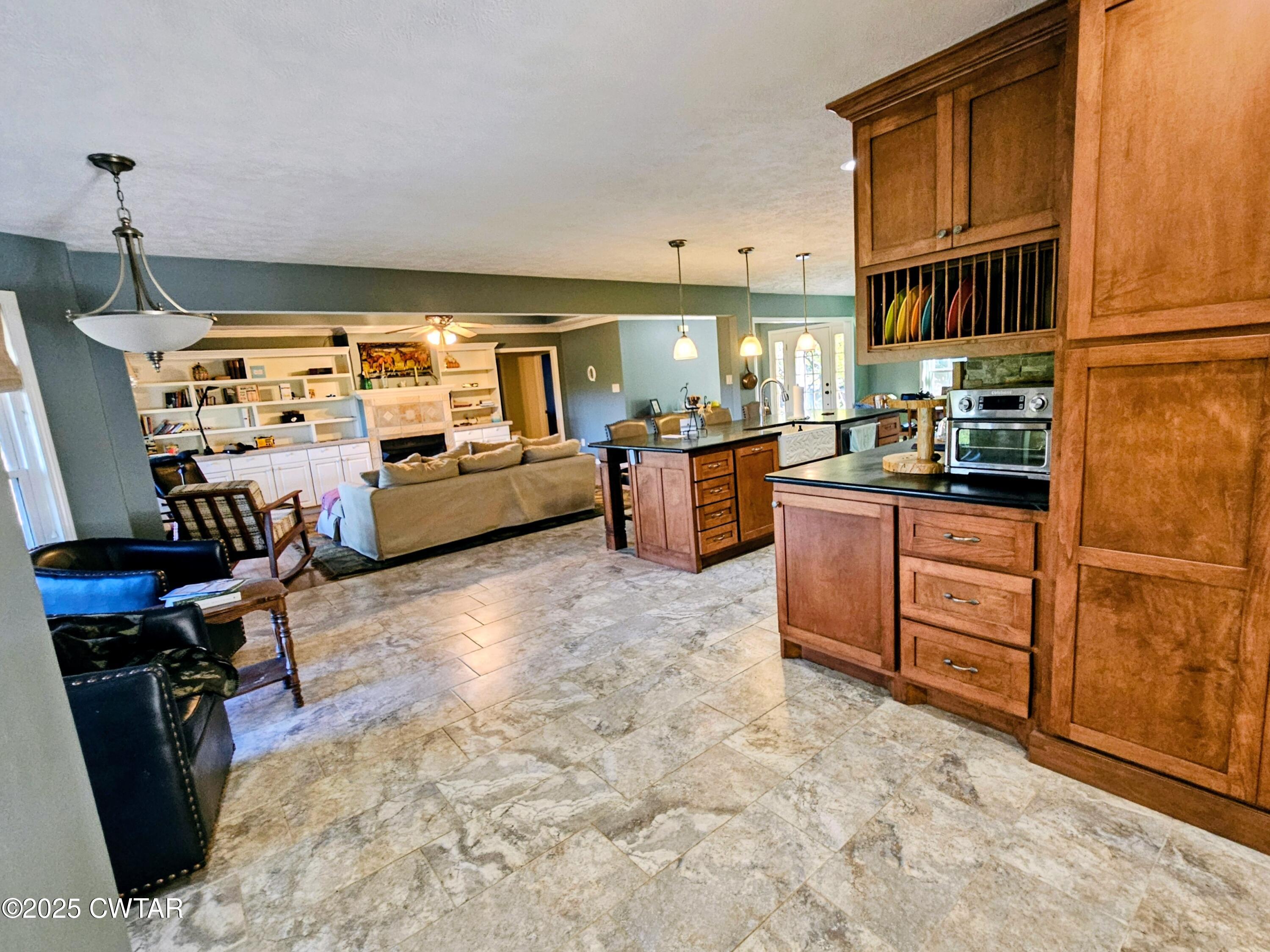 125 Hurts Chapel Road Jackson, TN 38301 - Photo 9 of 50 a kitchen with sink refrigerator and stove