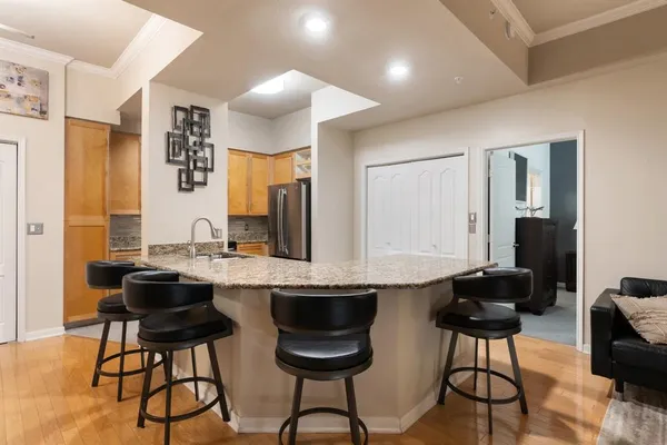 a kitchen with a table and chairs in it
