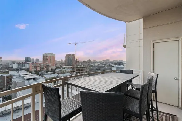 a view of a terrace with a table and chairs