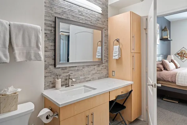 a en suite bathroom with a sink and a mirror