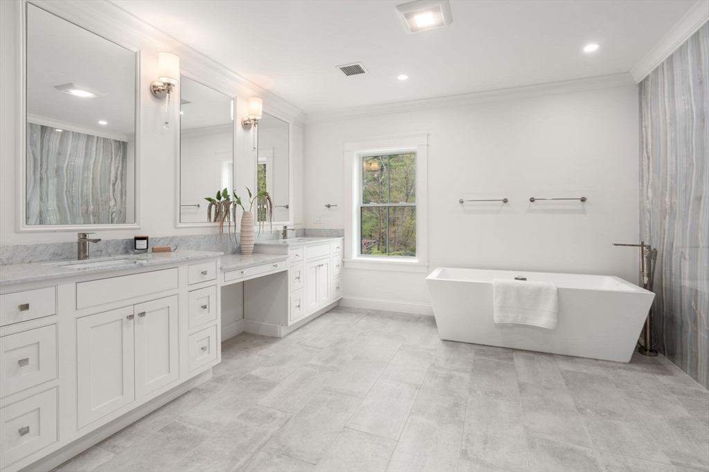 82 Deer Path Lane Weston, MA 02493 - Photo 20 of 42 a bathroom with a granite countertop sink mirror and bathtub