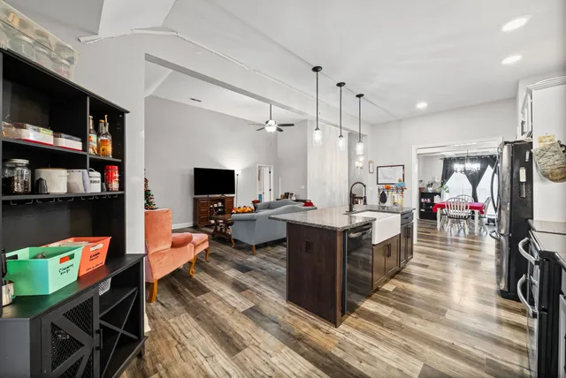 a kitchen with stainless steel appliances granite countertop a stove and refrigerator