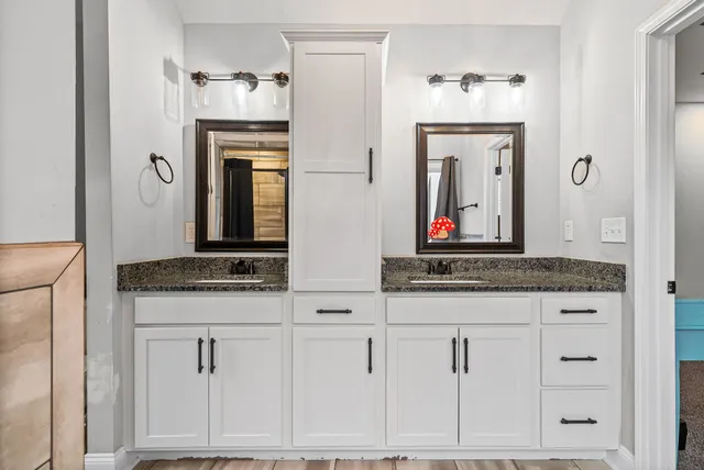a bathroom with a tub and shower