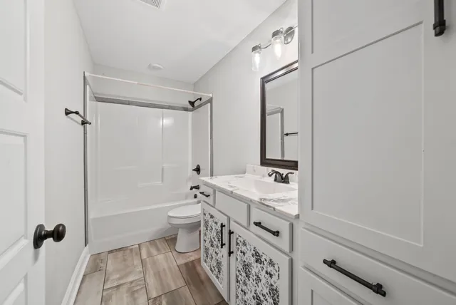 a view of livingroom with furniture and flat screen tv