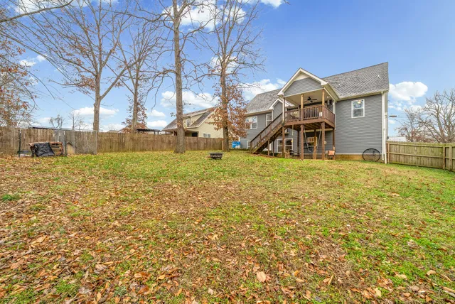 a view of a yard with trees