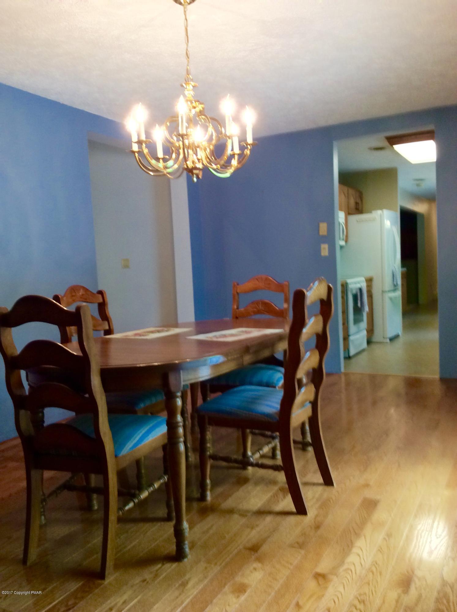 2125 Laurel Ridge Road East Stroudsburg, PA 18302 - Photo 13 of 54 a dining room with furniture and chandelier