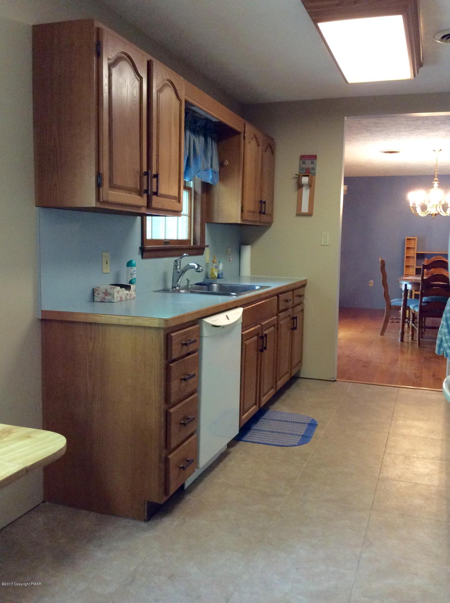 2125 Laurel Ridge Road East Stroudsburg, PA 18302 - Photo 18 of 54 a kitchen with stainless steel appliances granite countertop a stove a sink and a microwave