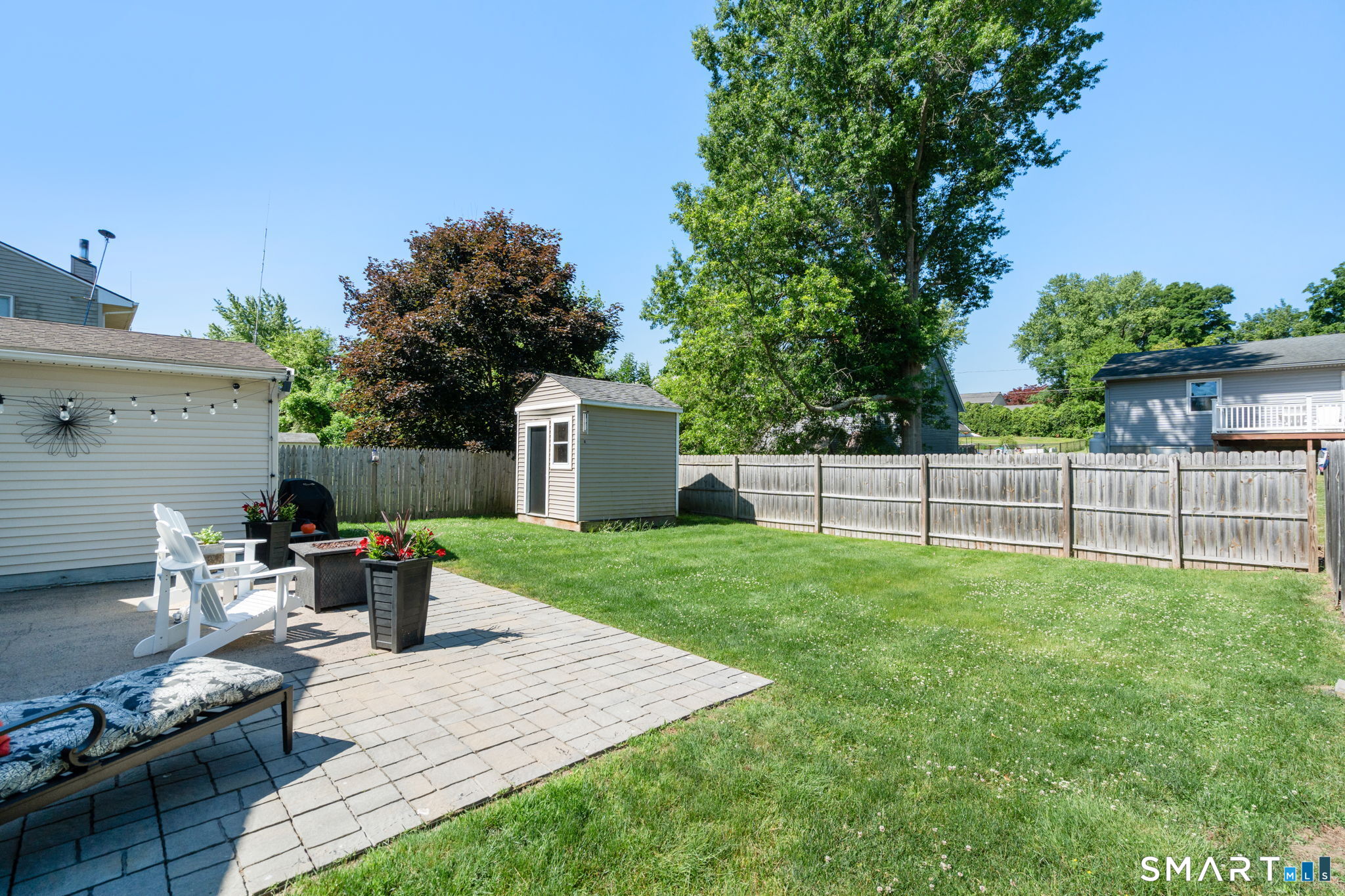 31 Cowan Street Suffield, CT 06078 - Photo 25 of 29 a view of a backyard with furniture