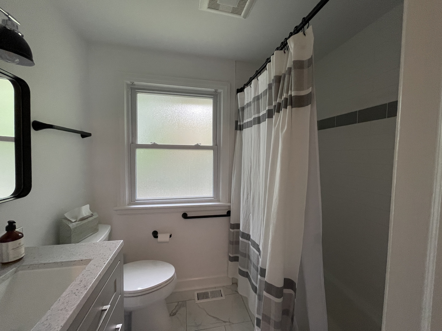 602 North President Street Wheaton, IL 60187 - Photo 13 of 16 a bathroom with a sink toilet and shower