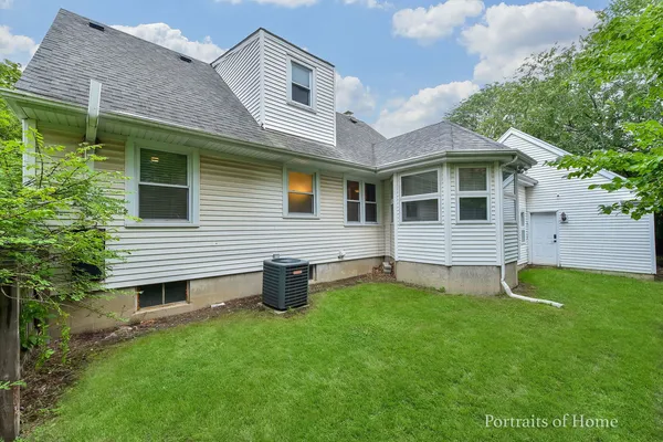 a view of a house with a backyard