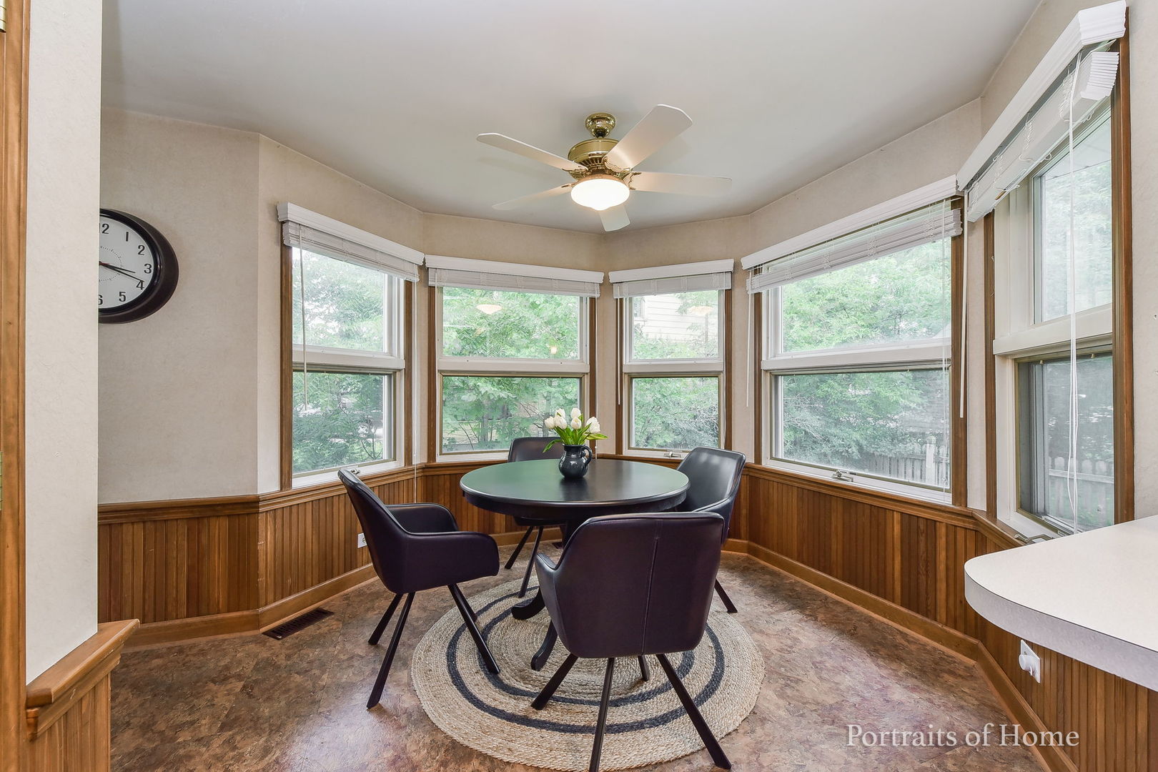 602 North President Street Wheaton, IL 60187 - Photo 7 of 16 a dining room with furniture a chandelier and wooden floor