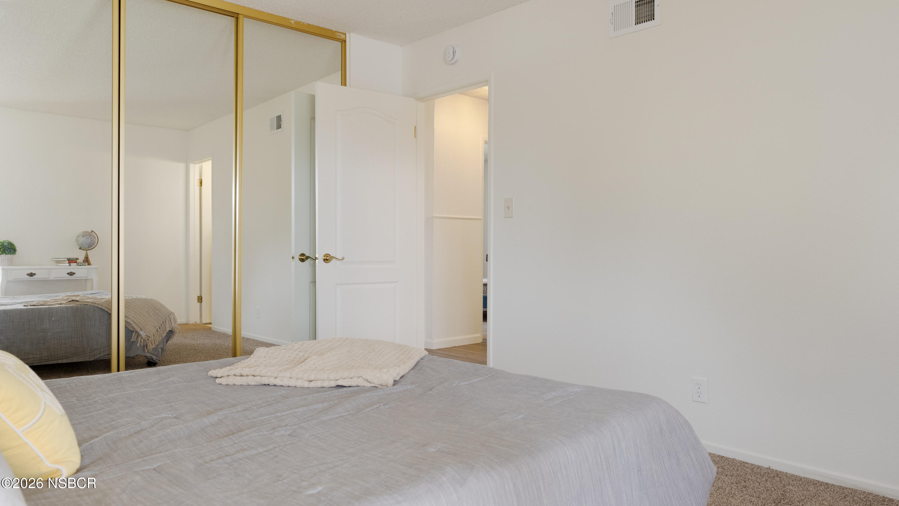 1312 North First Place Lompoc, CA 93436 - Photo 26 of 38 a bedroom with a bed and a mirror
