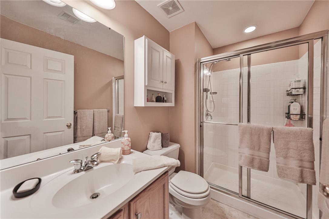 138 Clover Hollow Road Easton, PA 18045 - Photo 73 of 95 A well-lit primary bathroom featuring a convenient walk-in shower and ample vanity space.