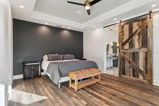 a bedroom with a large bed and a window