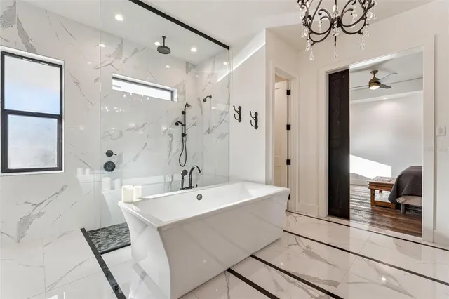 a spacious bathroom with a double vanity sink a large mirror and shower
