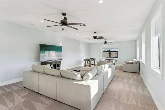 a kitchen with a stove a sink and a dining table