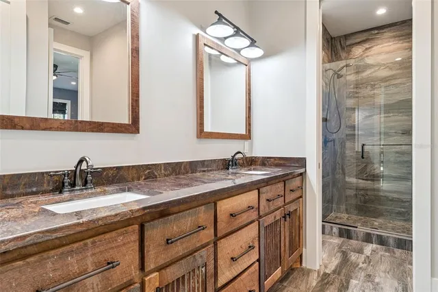 a view of a workspace with furniture and a ceiling fan