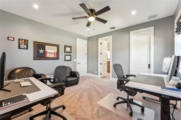 a work room with furniture and windows