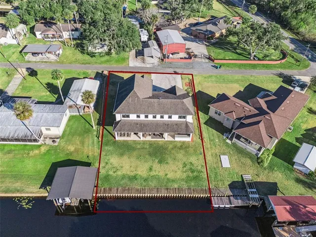 an aerial view of houses with outdoor space