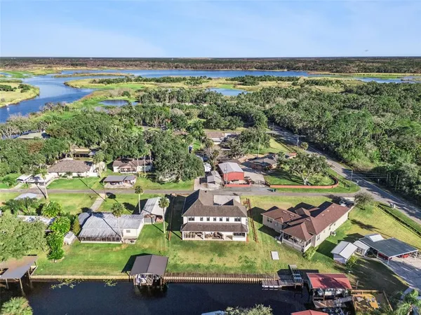 an aerial view of residential houses with outdoor space