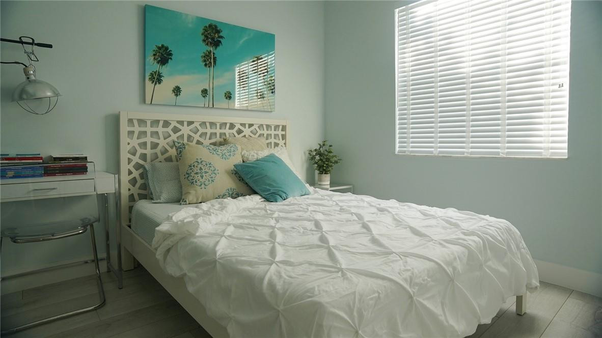 9421 Old Pine Road Boca Raton, FL 33428 - Photo 18 of 42 a large white bed in a bedroom next to a window