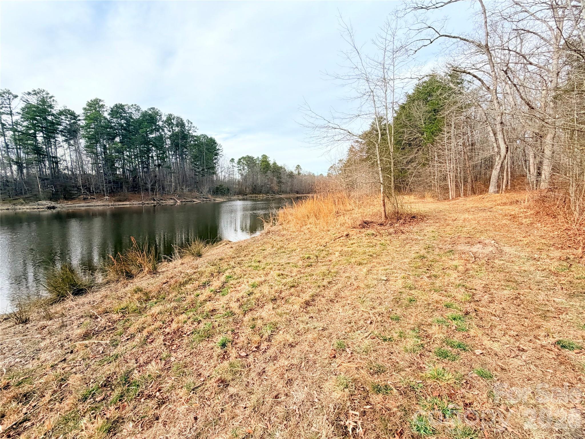 1266 Old Lincolnton Crouse Road Crouse, NC 28033 - Photo 25 of 34 a view of a lake next to a building