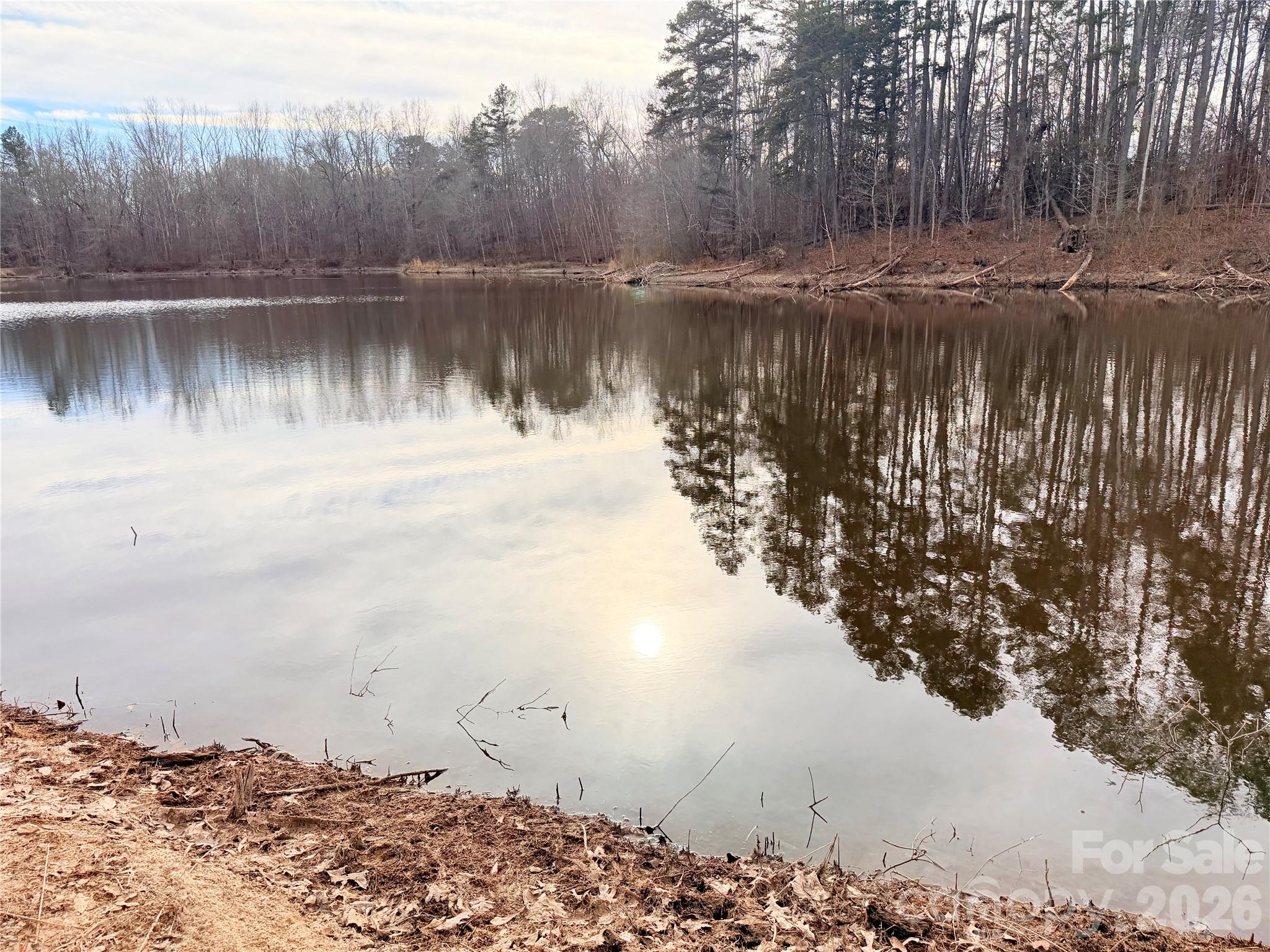 1266 Old Lincolnton Crouse Road Crouse, NC 28033 - Photo 29 of 34 a view of a lake next to a yard