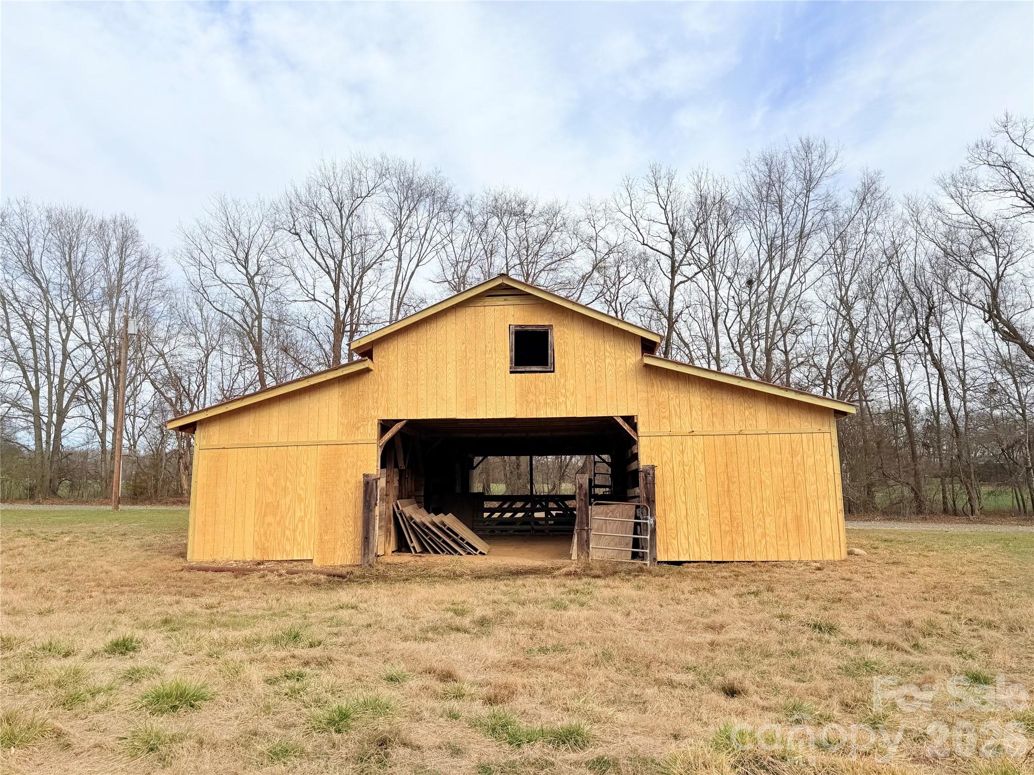 1266 Old Lincolnton Crouse Road Crouse, NC 28033 - Photo 5 of 34 a view of small house with a yard and garage