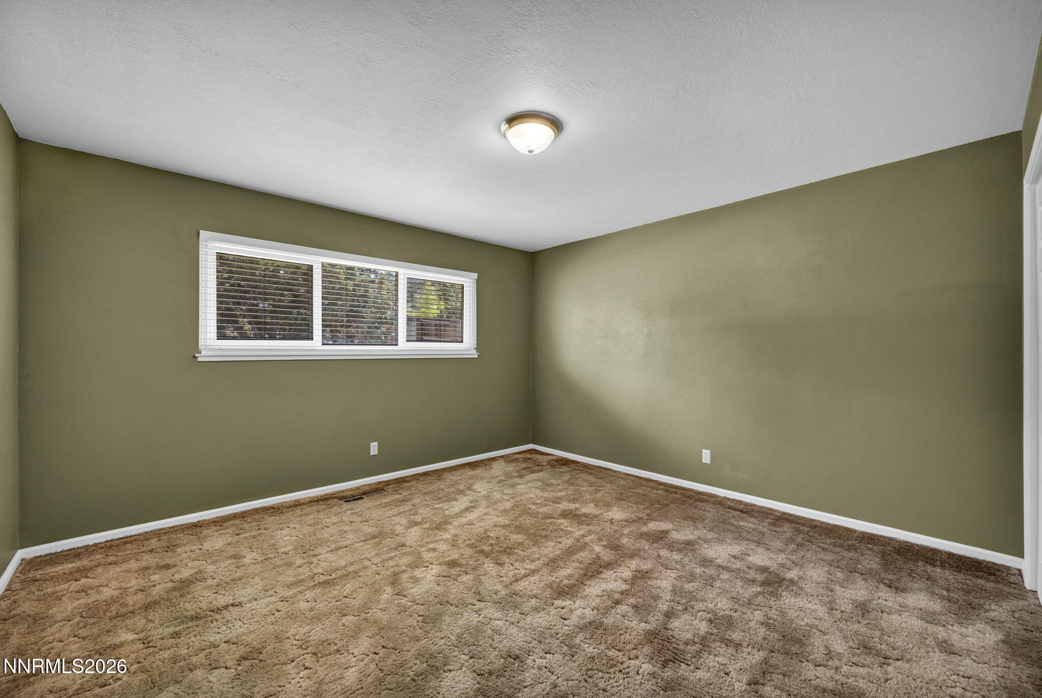 14190 Rim Rock Drive Reno, NV 89521 - Photo 39 of 68 a view of an empty room with a window
