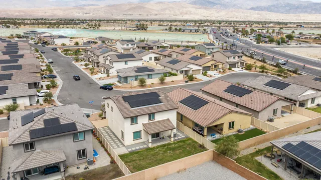 an aerial view of a house with a lake view
