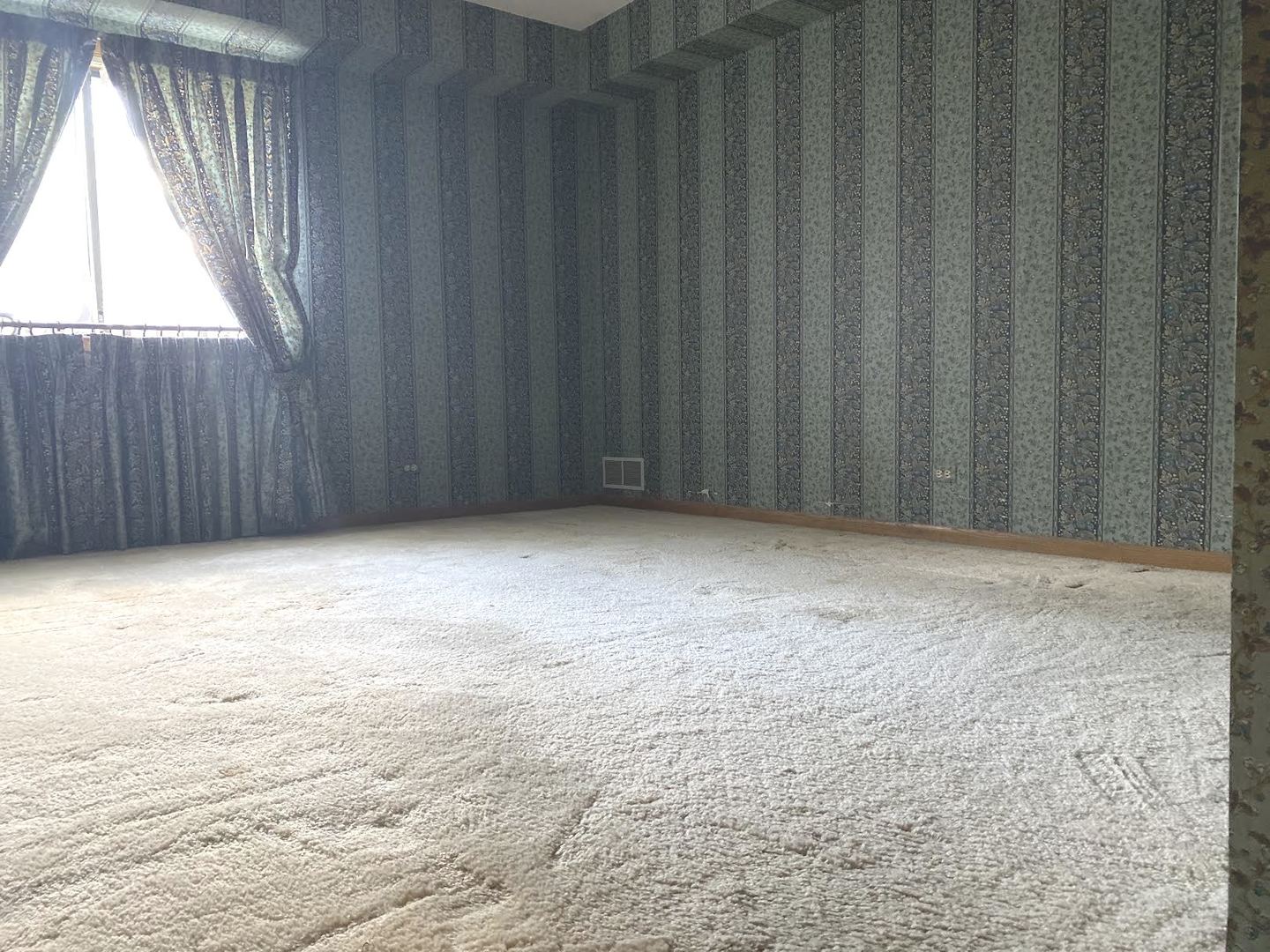 1503 Woodbridge Road, Unit 1C Joliet, IL 60436 - Photo 5 of 8 a view of an empty room with a window