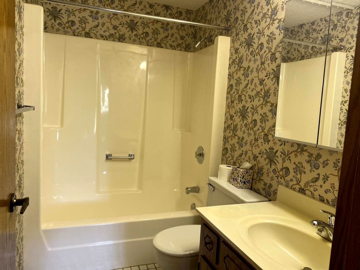 1503 Woodbridge Road, Unit 1C Joliet, IL 60436 - Photo 6 of 8 a bathroom with a sink toilet and shower