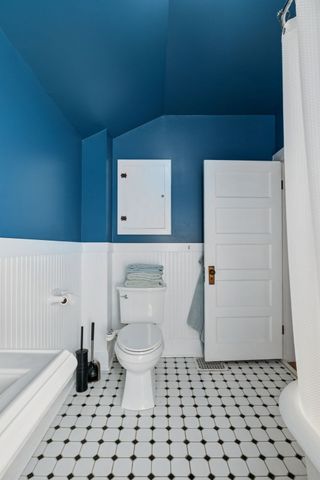 a bathroom with a toilet a sink and a bathtub